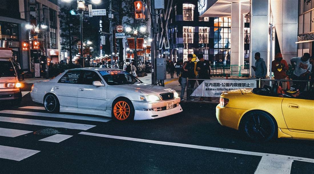 Modified Japanese cars on a Tokyo street at night